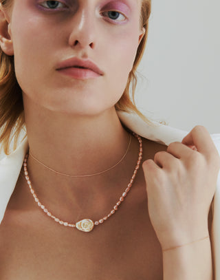 bare pearl necklace